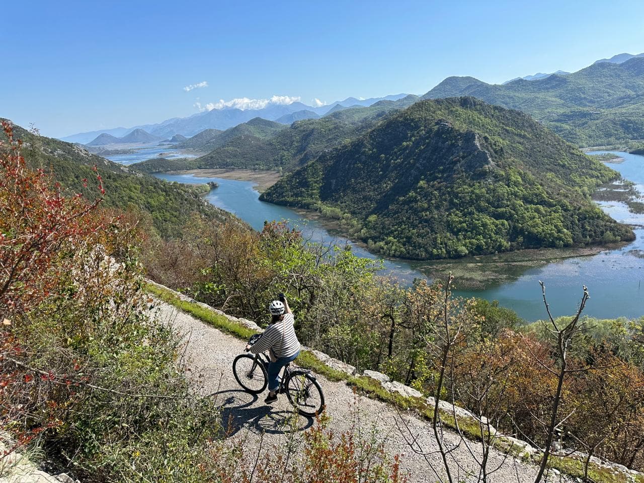Cyclists on the road above Skadar Lake, Pavlova strana viewpoint