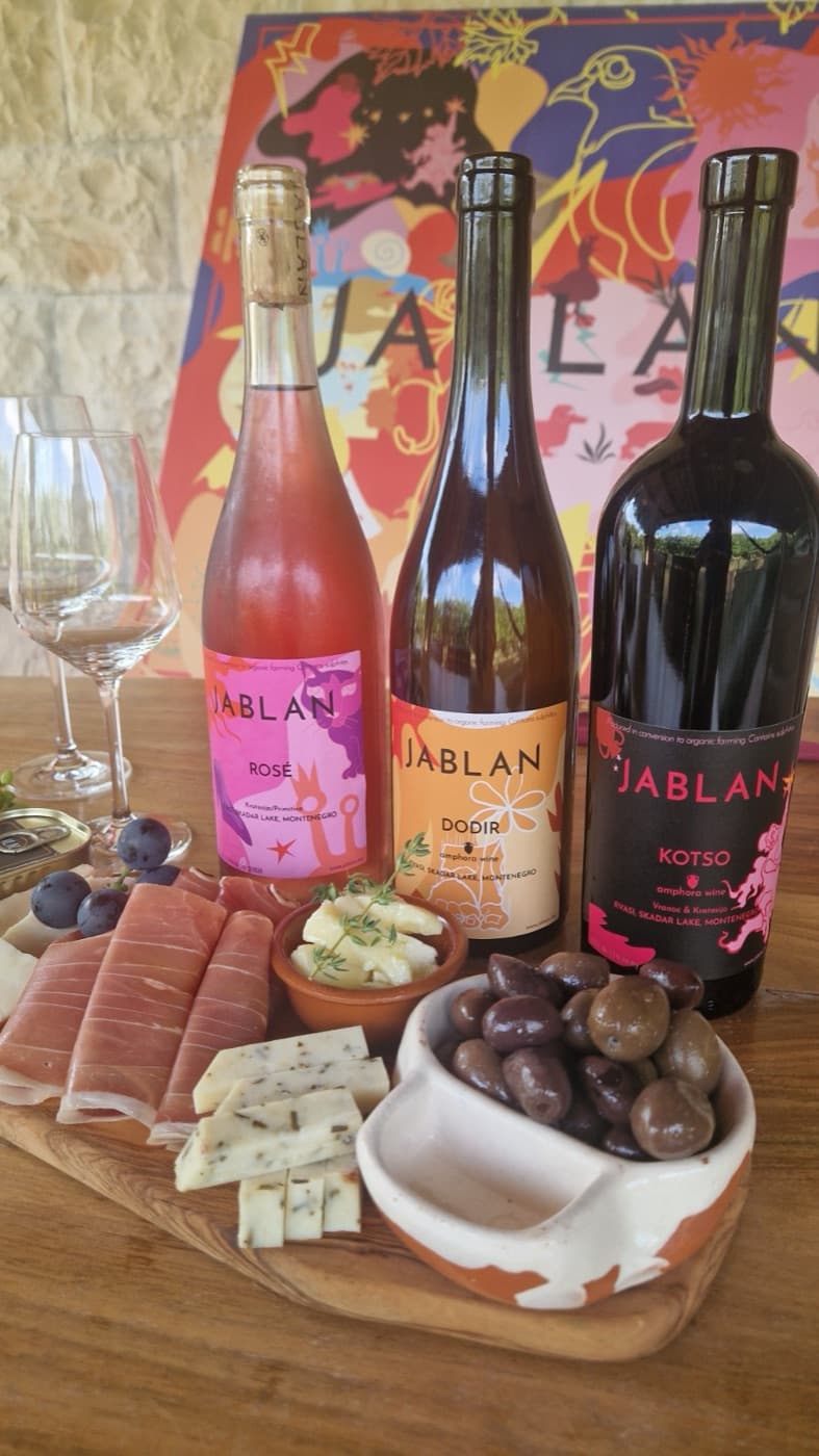 Three bottles of Jablan wine — Rosé, Dodir and Kotso — with a charcuterie board